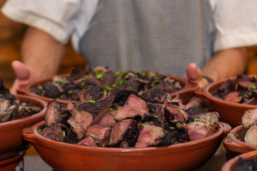 Serving feijoadafeijoada buffet, traditional Brazilian dishbean stew