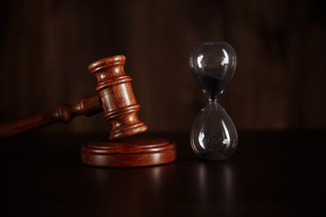 Judge gavel and hourglass. Law and time concept.