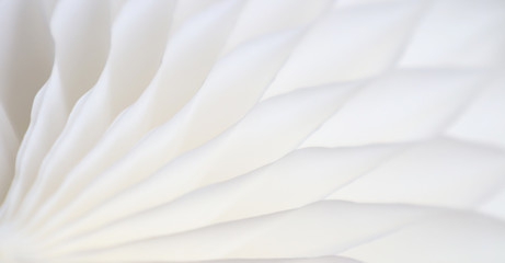 White abstract background with bizarre pattern. Soft lines transition light and dark shadows. Photos with soft focus.