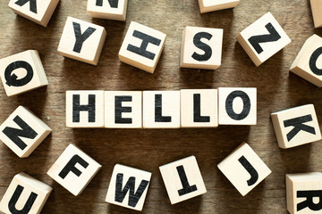 Letter block in word hello with another block on wood background © bankrx