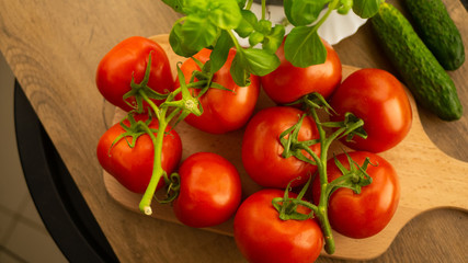 
Vegetables. Tomatoes and cucumbers with basil. Ready free entry space