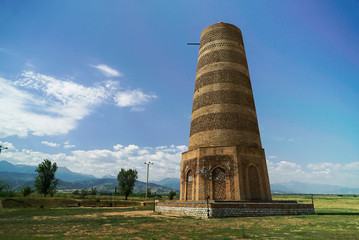 Burana Tower is a large minaret in the Chuy Valley in Tokmok, Kyrgyzstan - 349711432