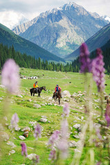 Horse riding with a beautiful landscape at Altyn Arashan,  Karakol, Krygyzstan