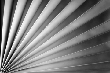Paper folded zigzag. Textured monochrome background for design.