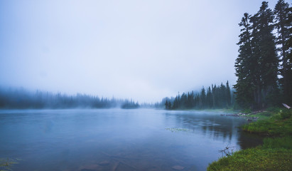 lake in the forest  with a lot of fog. © checubus
