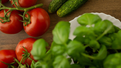 
Vegetables. Tomatoes and cucumbers with basil. Ready free entry space