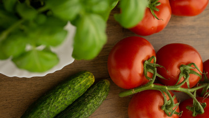 
Vegetables. Tomatoes and cucumbers with basil. Ready free entry space