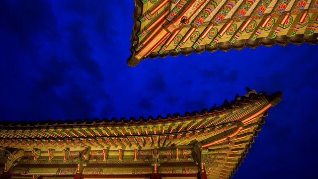 timelapse of night view with building and roof in gyeongbokgung palace (royal palace) 
