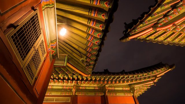 timelapse of night view with building and roof in gyeongbokgung palace (royal palace) 