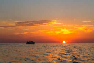 Orange sunset in sea from the coast of Sicily.