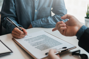 Businessman and lawyer discuss the contract document. Treaty of the law. Sign a contract business.