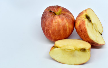 Naklejka na ściany i meble Fresh, ripe, orange apple, sliced, isolated on a white background