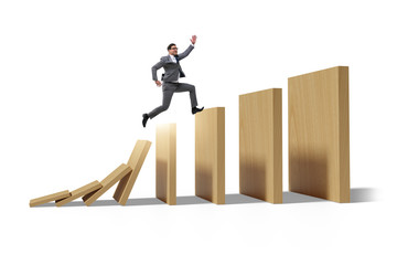 Fototapeta premium Businessman in domino effect concept