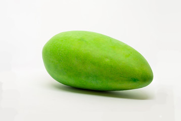 Mango fruit with shadows placed horizontally on a isolated white background.