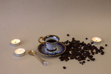 Fototapeta na wymiar .coffee, flowers, candles on a beige background as a symbol of home warmth and coziness