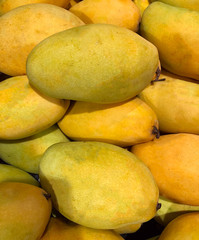 photo tropical mango fruit on the counter of the supermarket