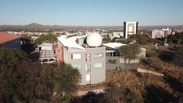 4K aerial drone video Windhoek meteorological service viewpoint, Windhoek high school sport grounds in city center in Namibia's capital in Namibia
