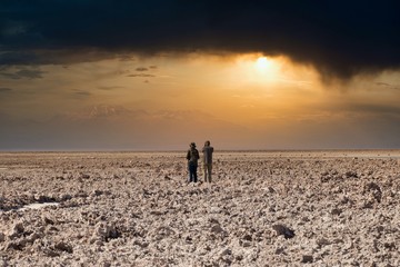 Couple looking at the mountains during sunset