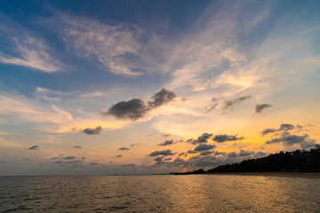 sunset with couldy at the beach