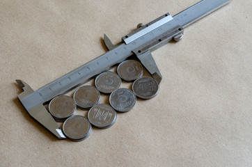 Light coins and vernier caliper.