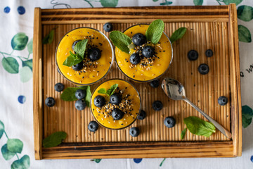 Fresh mango smoothie with blueberries. Healthy diet nutrition. Vegetarian healthy food. Homemade...