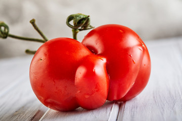 Ugly fruit or vegetable. Severely malformed mutant tomato. Food shops mostly prefer the best quality fruit and vegetables. Ugly fruit is not in high demand