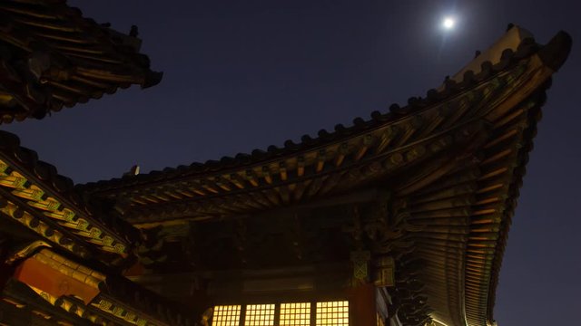 timelapse of night view with building and roof in gyeongbokgung palace (royal palace) 