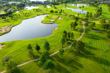 Golf course sport Aerial top view of golf field landscape with sunrise view in the morning shot....