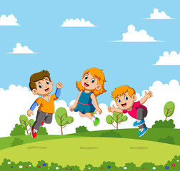 Obraz na płótnie Canvas Boys and girls jumping in a beautiful garden
