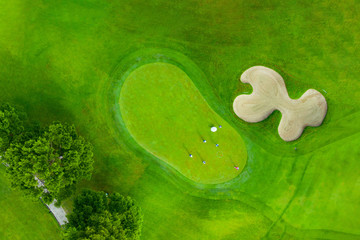 Golf course sport Aerial top view of golf field landscape with sunrise view in the morning shot....