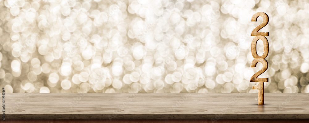 Aufkleber 2021 happy new year wood number (3d rendering) on wood table with sparkling gold bokeh wall,leave sp