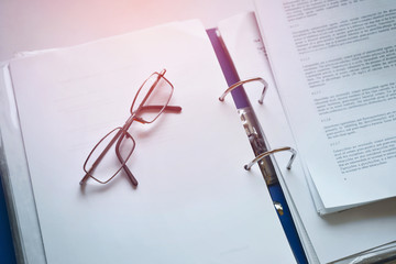 Glasses for visual acuity over printed documents. Paperwork. 