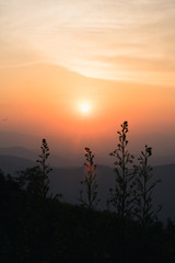 Obraz premium Sunset in the evening with alternating mountains