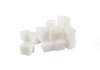 close up of sugar cubes on white background 