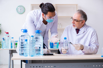 Two chemists working in the lab