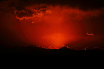 sun almost go down in the red sky