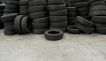 Pile of tires stack in warehouse waiting to transport to distributors, new car tyres product in manufacturing factory background © ZETHA_WORK