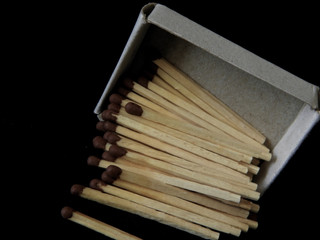 Matchbox and matches close up on a black background