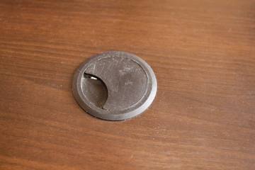 The plastic cover for wiring on the office desk is a dummy.