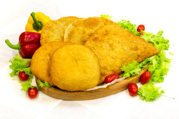 Pie, tart, pastry, baked gate with filling on a plate on the table, lunch, fast food
