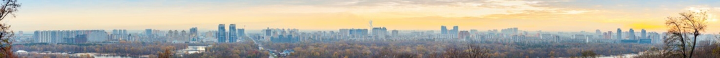 Fototapeta na wymiar Panorama of Kyiv city and Dnipro river at sunrise in dawn, panoramic view to the colorful autumn cityscape in the morning, Ukraine