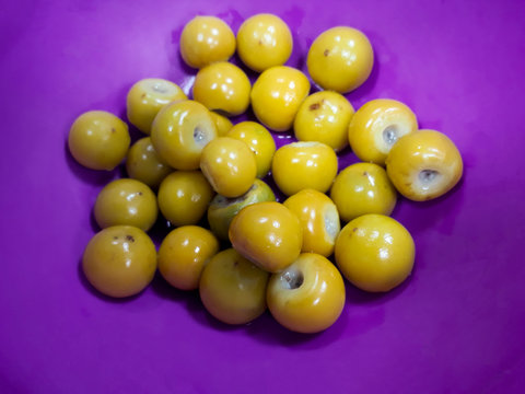 Dish served with Nances inside, tropical seasonal fruit, Byrsonima crassifolia in Guatemala.

