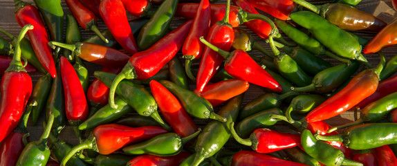 Large crop of red and green hot chili peppers