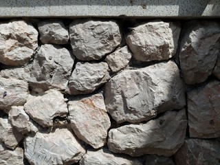 tileable Stone wall texture seamless in half dark shadow
