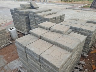 Drawing shape textured Paver stone regular blocks lay on the pallet at the road side walk
