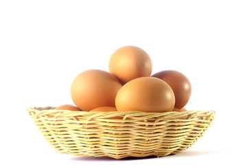 Egg in basket isolated on white background