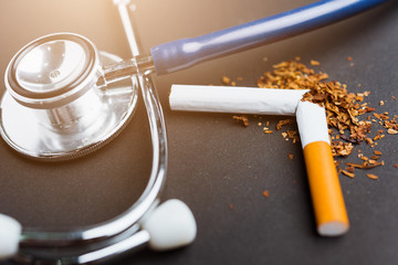 31 May of World No Tobacco Day, no smoking, close up of broken pile cigarette or tobacco and doctor...