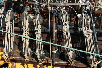 Rope pulley or tackle on a sailboat. Closeup view of a rope pulley or tackle on a sailboat