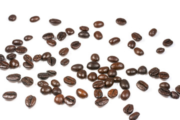 Roasted coffee beans splatter isolated on a white background.