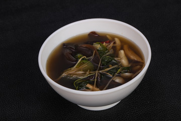 Thai style soup with meat and mushrooms